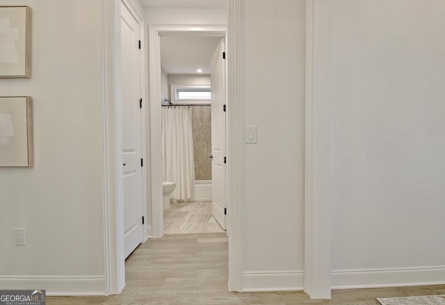 hallway featuring light hardwood / wood-style flooring