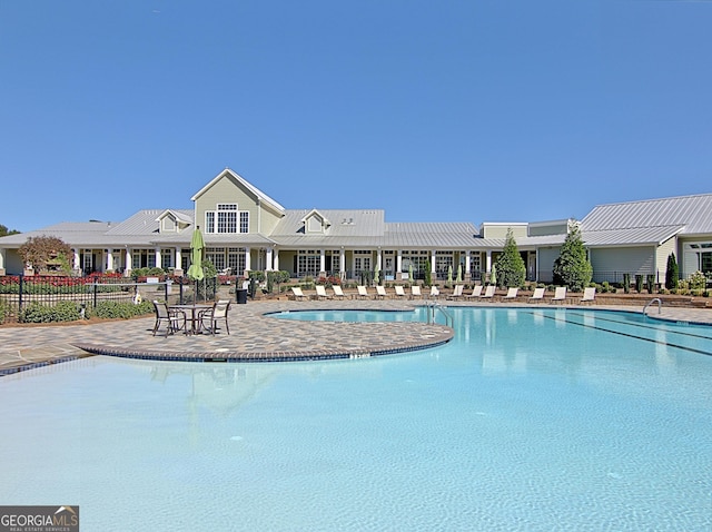 view of swimming pool featuring a patio