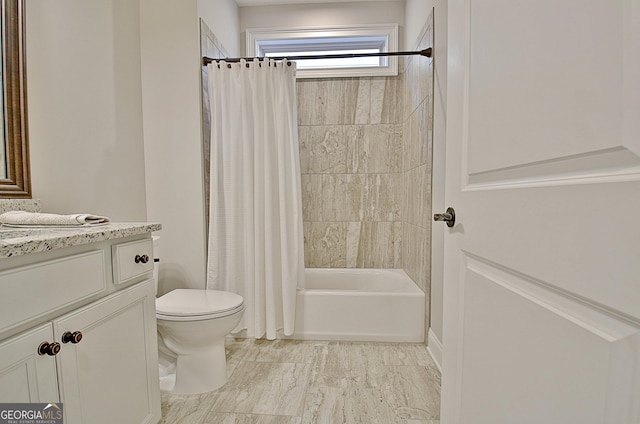 full bathroom featuring shower / bath combination with curtain, vanity, and toilet