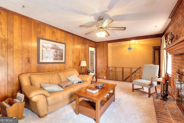 carpeted living room featuring crown molding, ceiling fan, and wooden walls