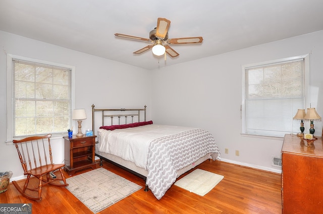 bedroom featuring ceiling fan and light wood-type flooring