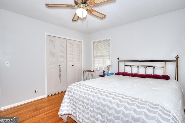 bedroom with a closet, ceiling fan, and light wood-type flooring