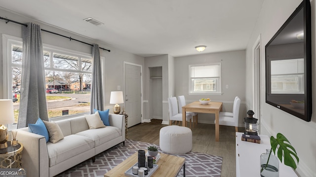 living room with dark hardwood / wood-style floors