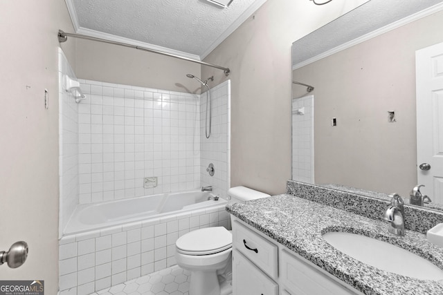 bathroom featuring crown molding, vanity, toilet, a textured ceiling, and tiled shower / bath combo