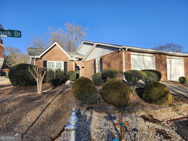 ranch-style home featuring a garage