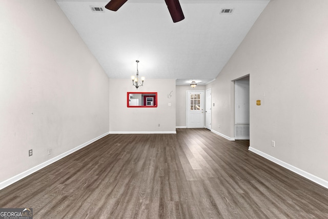 unfurnished living room featuring visible vents, baseboards, ceiling fan with notable chandelier, and vaulted ceiling