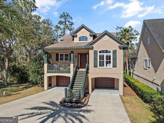 view of front of property featuring a garage and covered porch