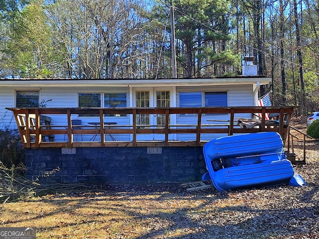 view of front facade with a wooden deck