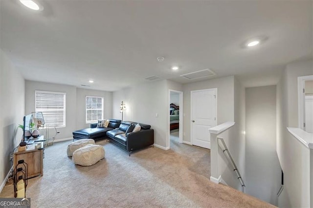 8819 Sibella Ct, Lithia Springs, GA 30122 - living area featuring baseboards, carpet floors, recessed lighting, and attic access