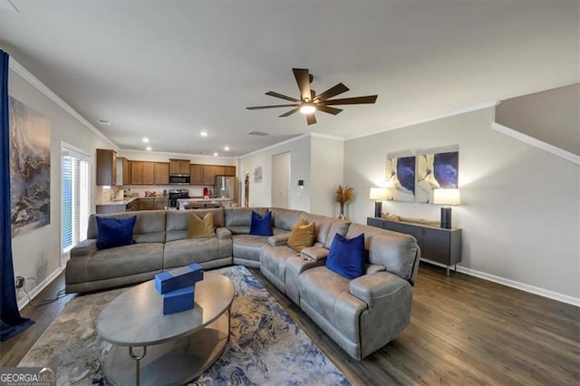 living room with crown molding, ceiling fan, and dark hardwood / wood-style flooring