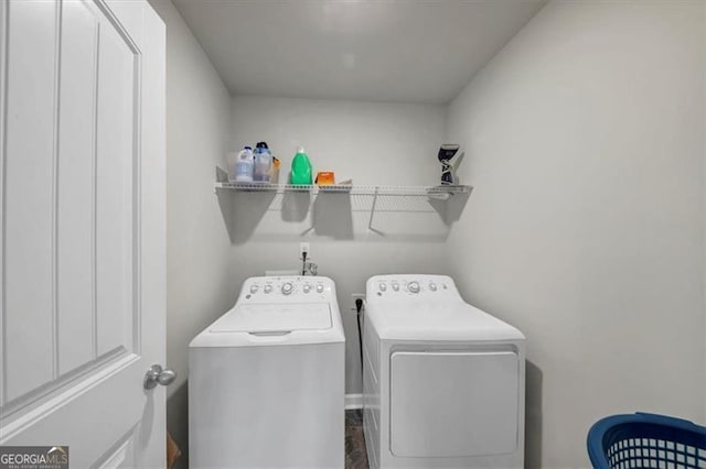 laundry room featuring washing machine and dryer