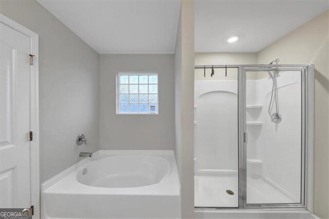 8819 Sibella Ct, Lithia Springs, GA 30122 - full bath featuring a stall shower and a bath