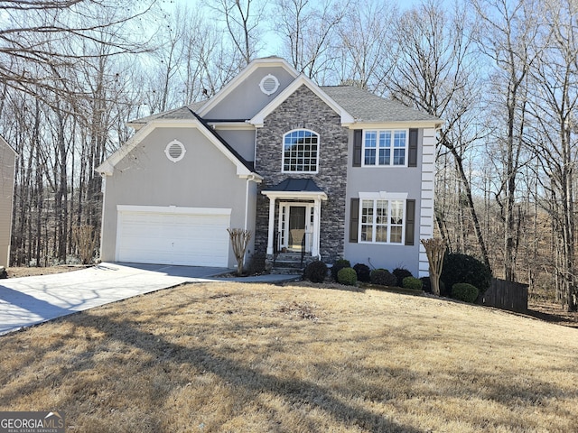 view of property featuring a garage and a front lawn