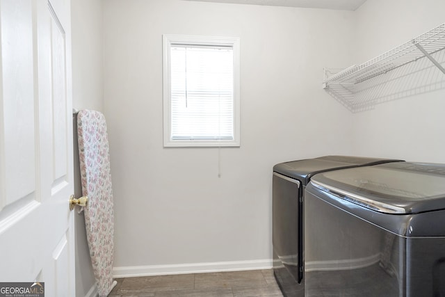 laundry room with washing machine and clothes dryer