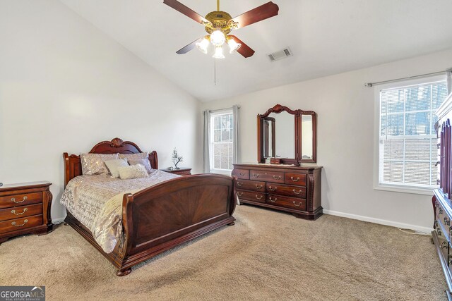 carpeted bedroom featuring lofted ceiling and ceiling fan