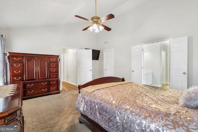 carpeted bedroom with ceiling fan and high vaulted ceiling