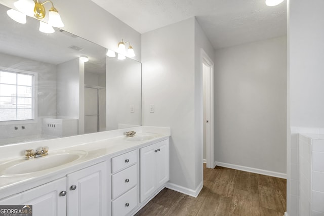 bathroom with vanity and a textured ceiling