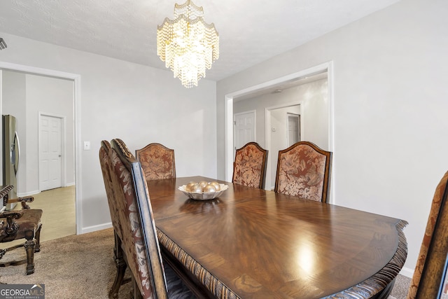 dining area featuring an inviting chandelier and carpet floors