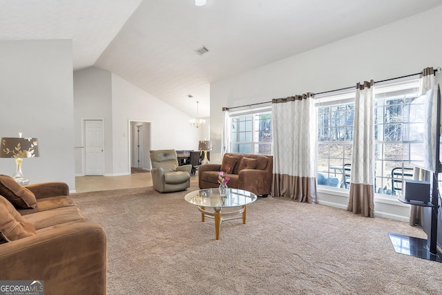 living room featuring high vaulted ceiling, a chandelier, and carpet floors