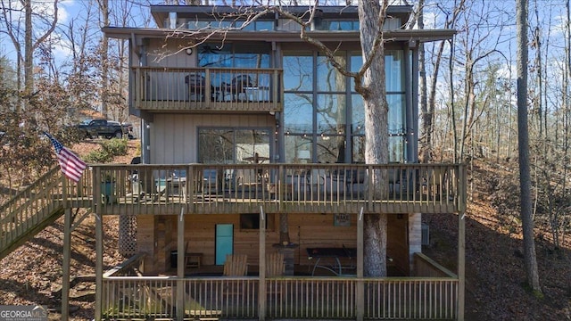 rear view of house with a wooden deck