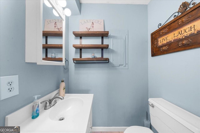 bathroom with vanity, electric panel, and toilet