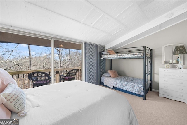 bedroom with lofted ceiling, carpet flooring, and access to outside