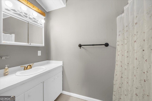 bathroom featuring vanity and a shower with shower curtain