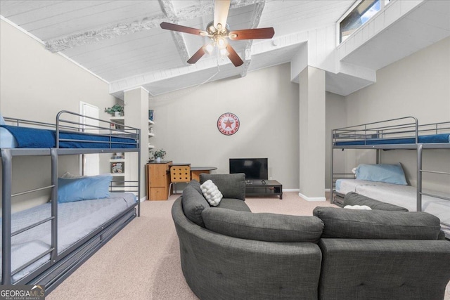 carpeted bedroom with ceiling fan and vaulted ceiling