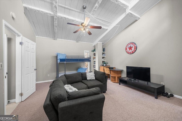 carpeted living room featuring lofted ceiling with beams, wooden ceiling, and ceiling fan