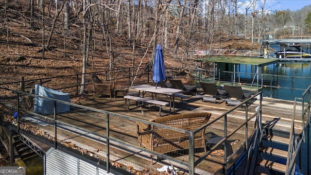 deck featuring a boat dock and a water view