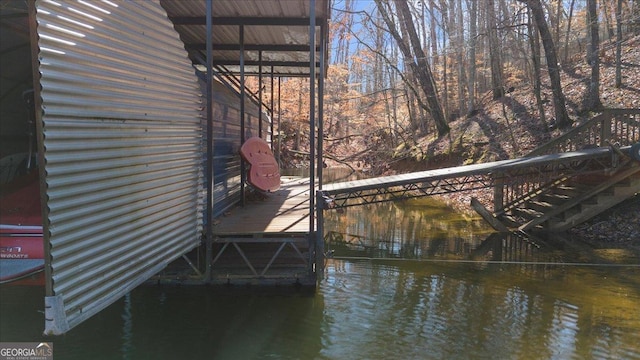 dock area with a water view