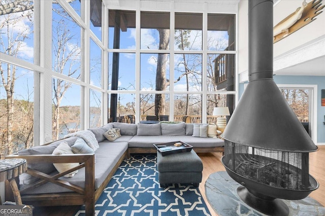 sunroom featuring a wood stove