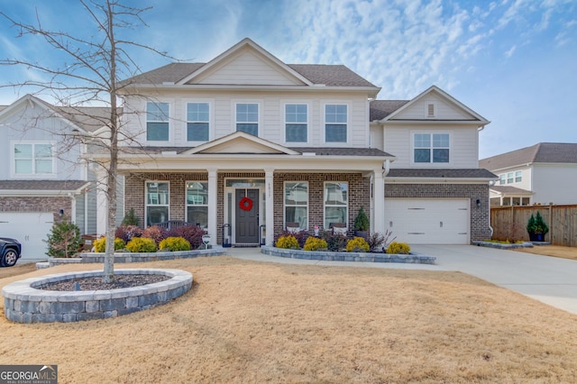 craftsman house with covered porch, a front yard, and a garage