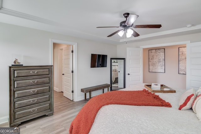 bedroom with ceiling fan, ornamental molding, and light wood-type flooring