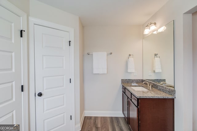 bathroom featuring wood-type flooring and vanity