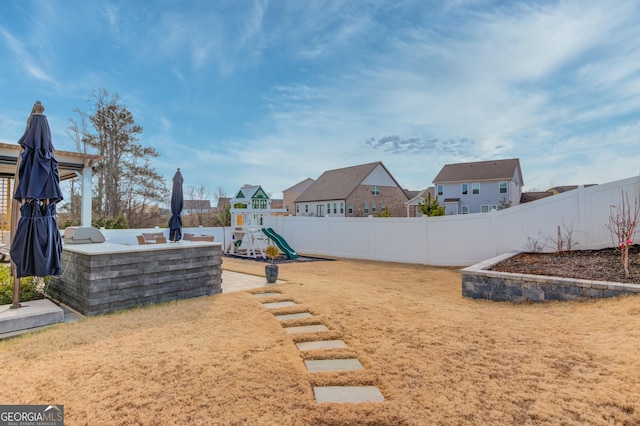 view of yard featuring a playground