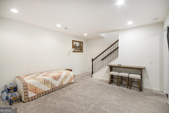 sitting room with light colored carpet