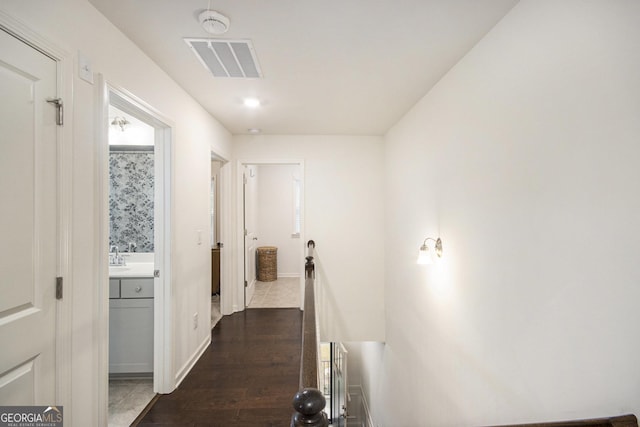 hallway featuring dark wood-type flooring