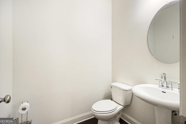 bathroom with sink and toilet