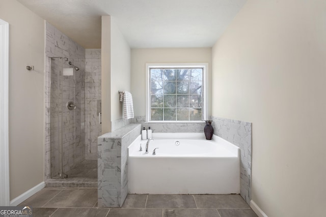 bathroom with shower with separate bathtub and tile patterned flooring