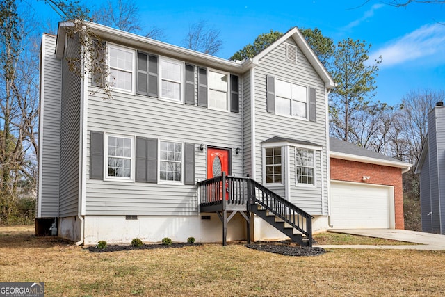 view of front of home featuring a garage and a front lawn