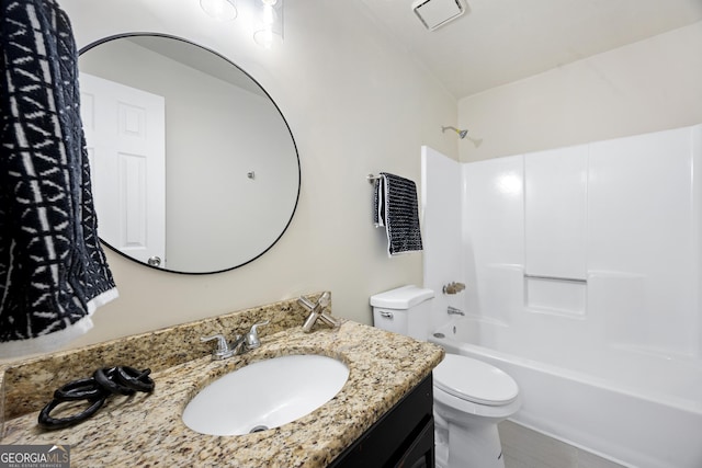 full bathroom with shower / washtub combination, vanity, and toilet