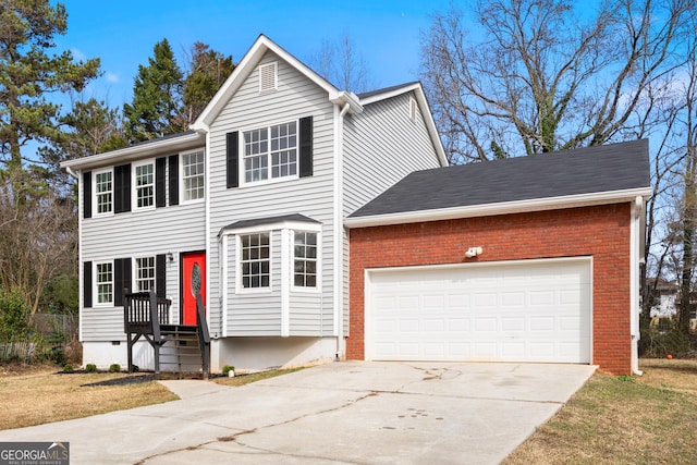 view of front of home featuring a garage and a front yard