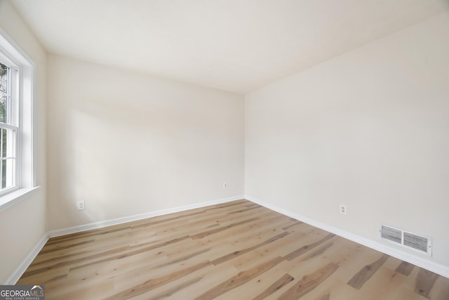 unfurnished room featuring light hardwood / wood-style flooring