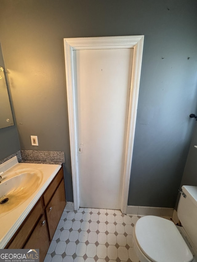 bathroom with vanity and toilet