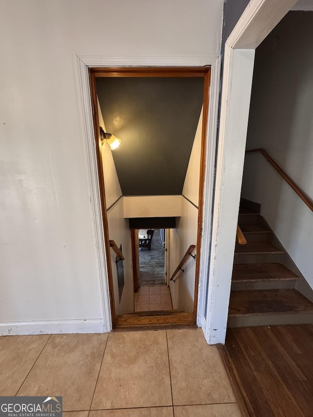 stairs with tile patterned floors