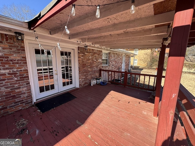 wooden deck featuring french doors