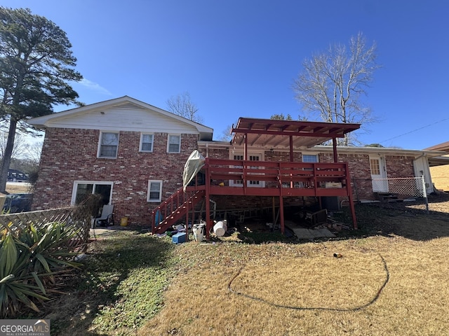 rear view of house featuring a deck and a pergola