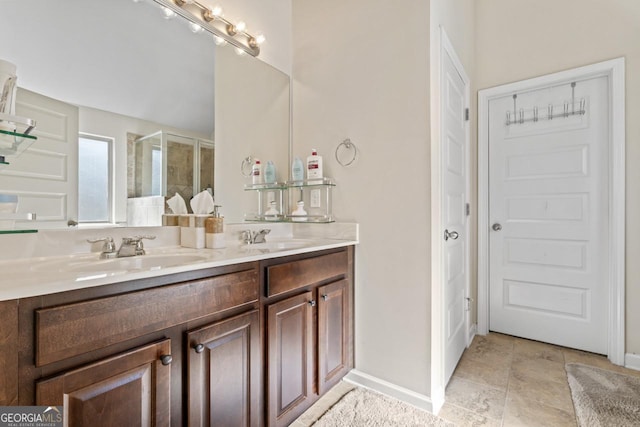 bathroom with walk in shower and vanity