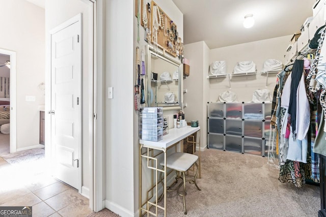 spacious closet with carpet flooring